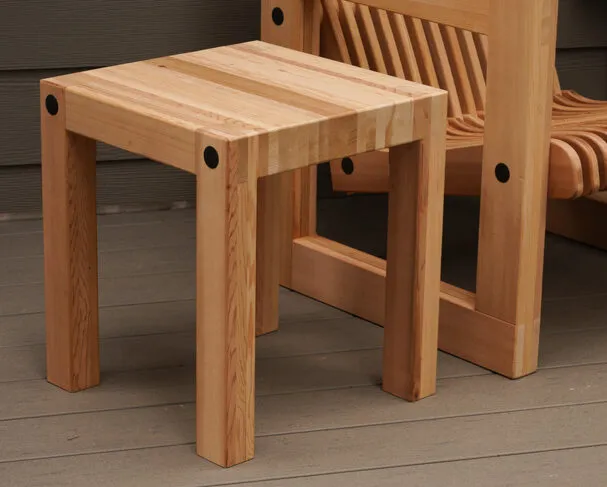 Asa Christiana builds an outdoor table that combines top and legs in a single assembly.